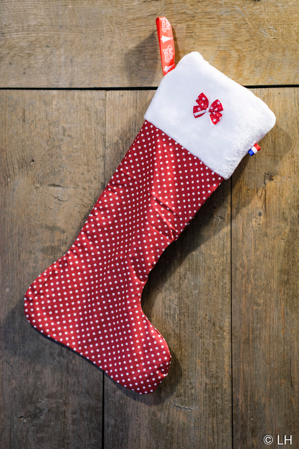 Botte de Noël rouge à pois blancs et son petit nœud