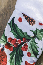 Botte de Noël blanche aux motifs houx et pommes de pin