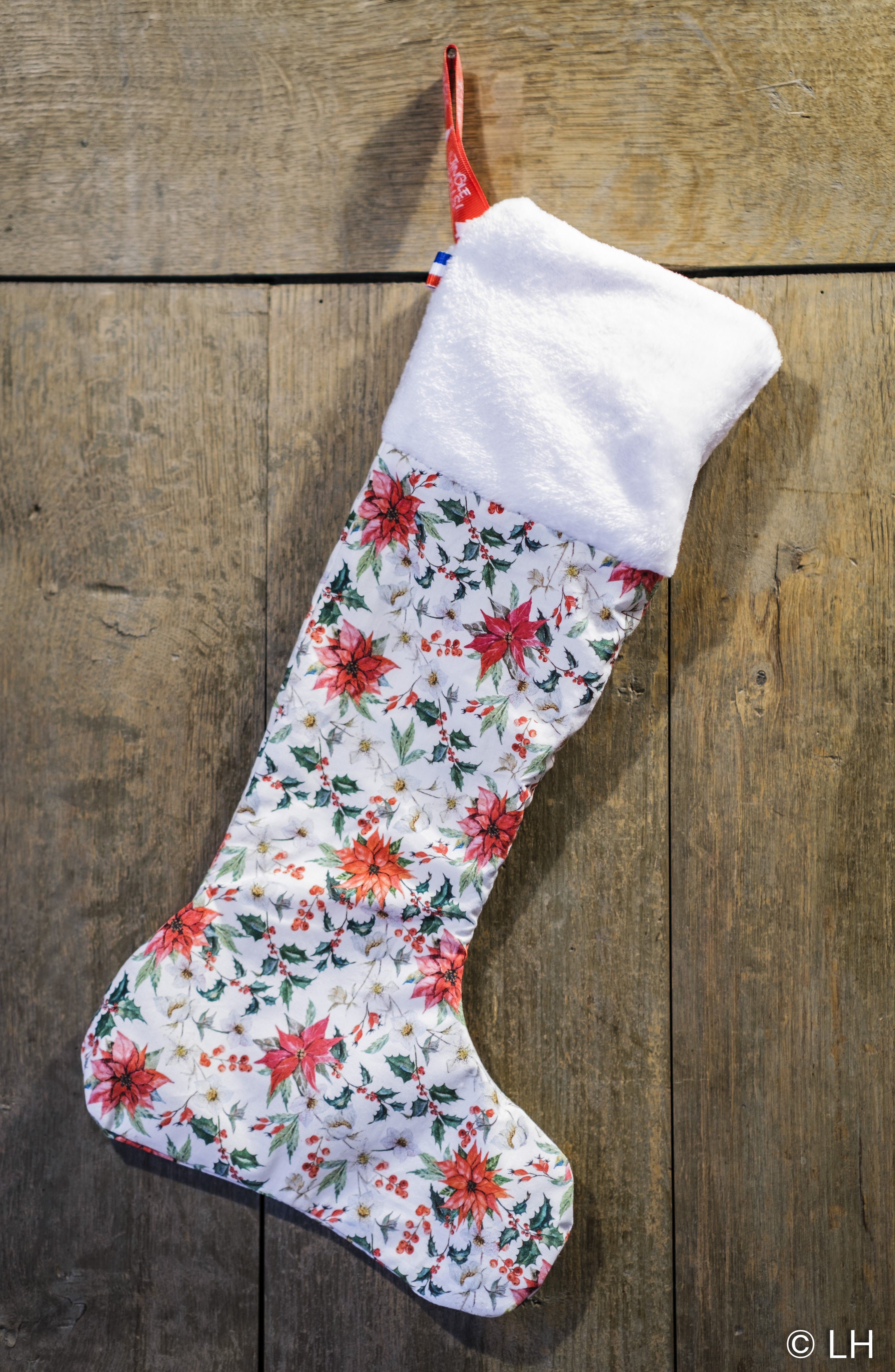 Botte de Noël blanche aux motifs fleuris