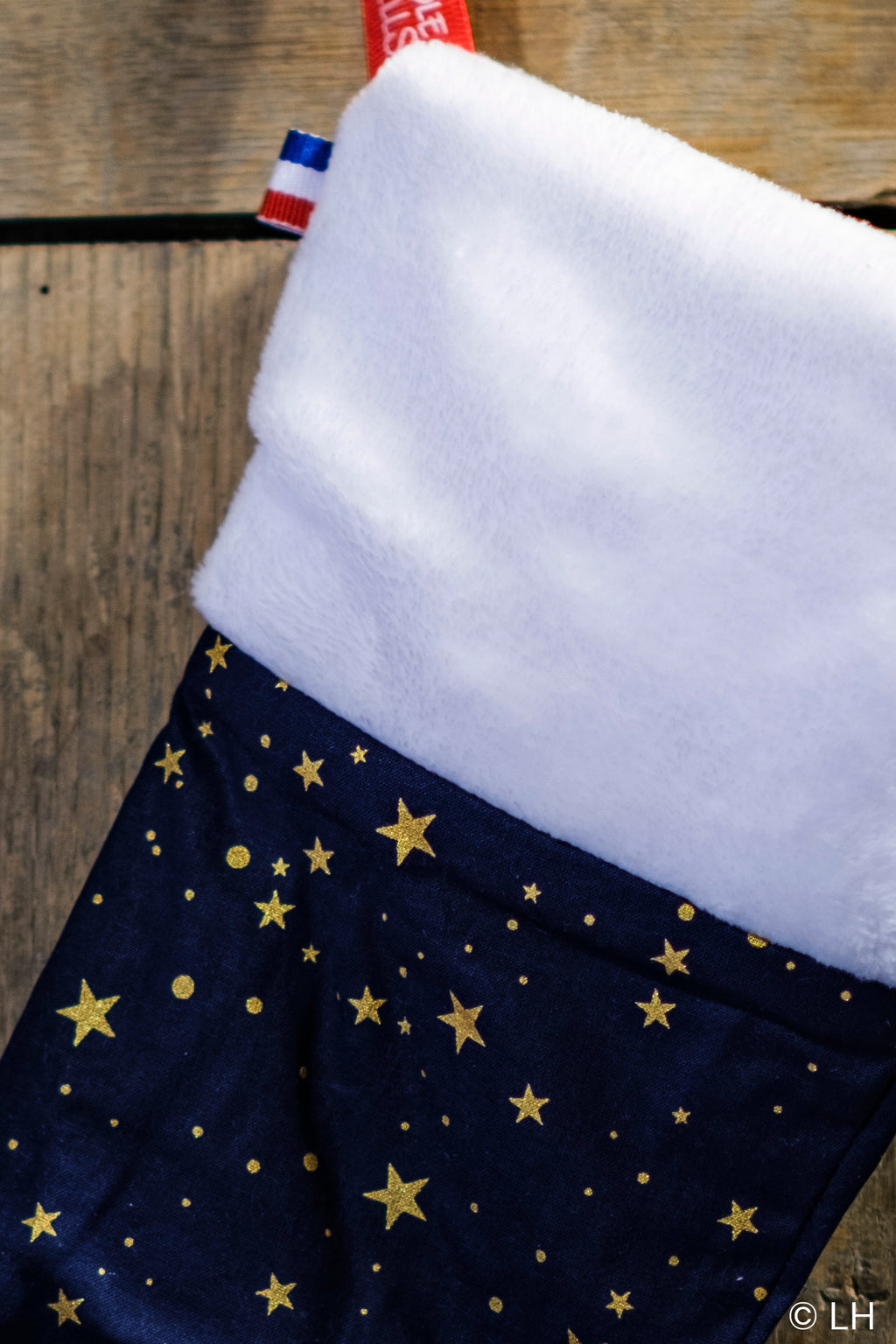 Botte de Noël bleu profond aux motifs étoiles dorées