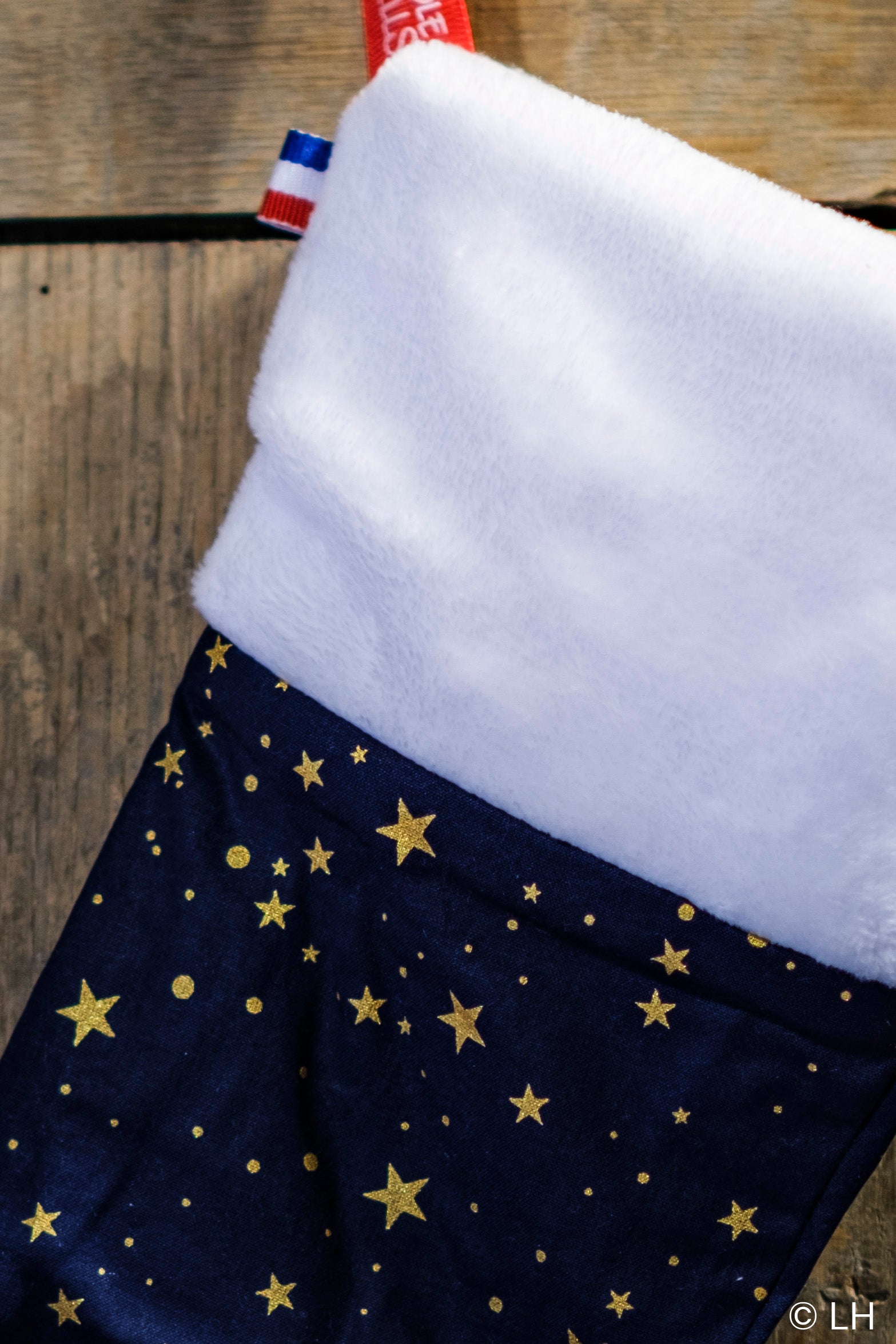 Botte de Noël bleu profond aux motifs étoiles dorées