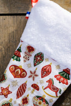 Botte de Noël blanche aux motifs décorations de Noël