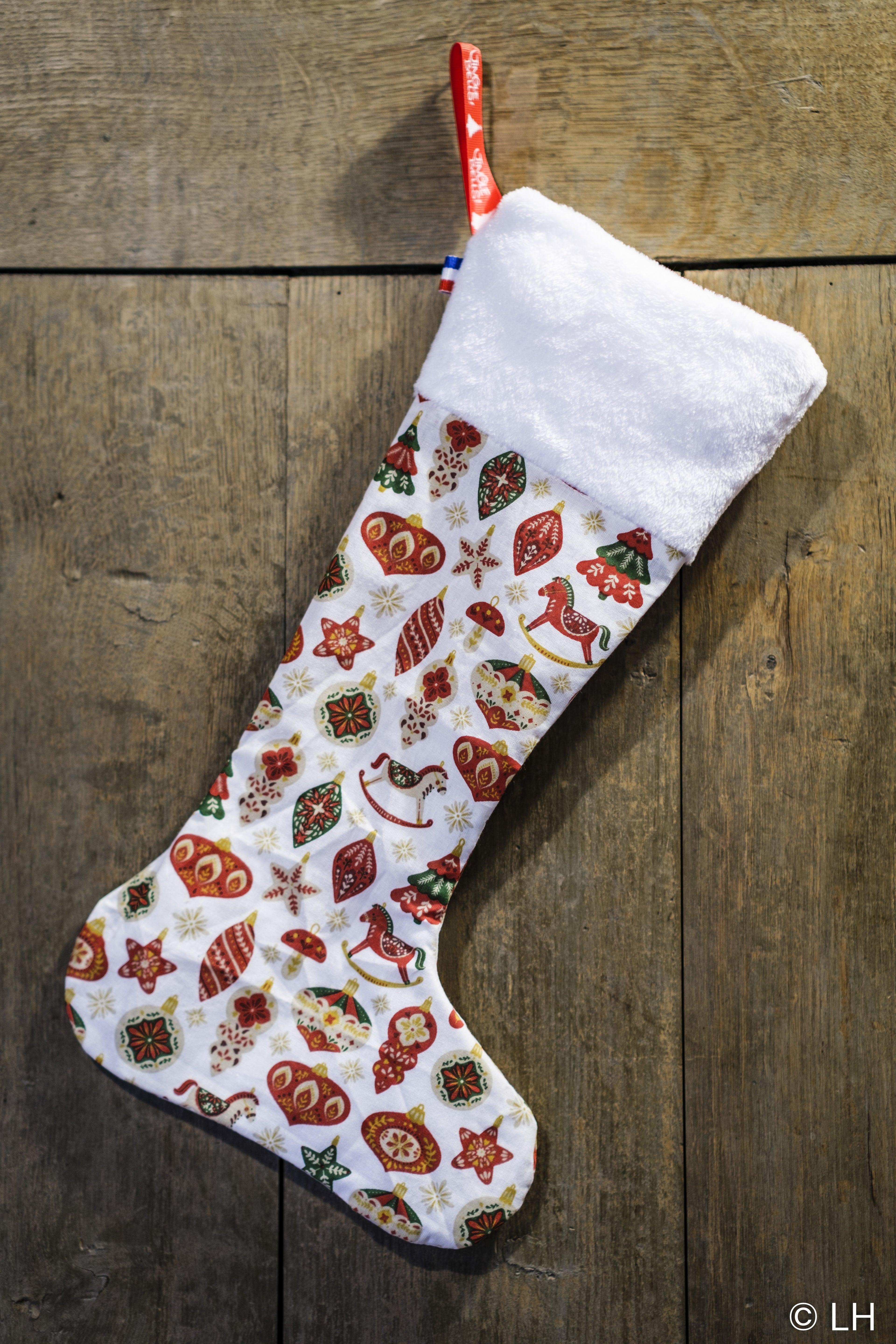 Botte de Noël blanche aux motifs décorations de Noël