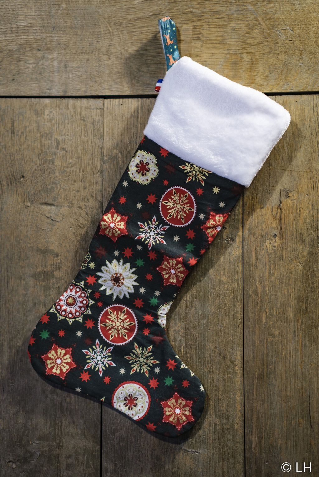 Botte de Noël vert foncé aux motifs étoiles de Noël