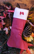 Botte de Noël rouge à pois blancs et son petit nœud