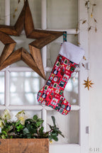 Botte de Noël rouge aux motifs dessins de Noël