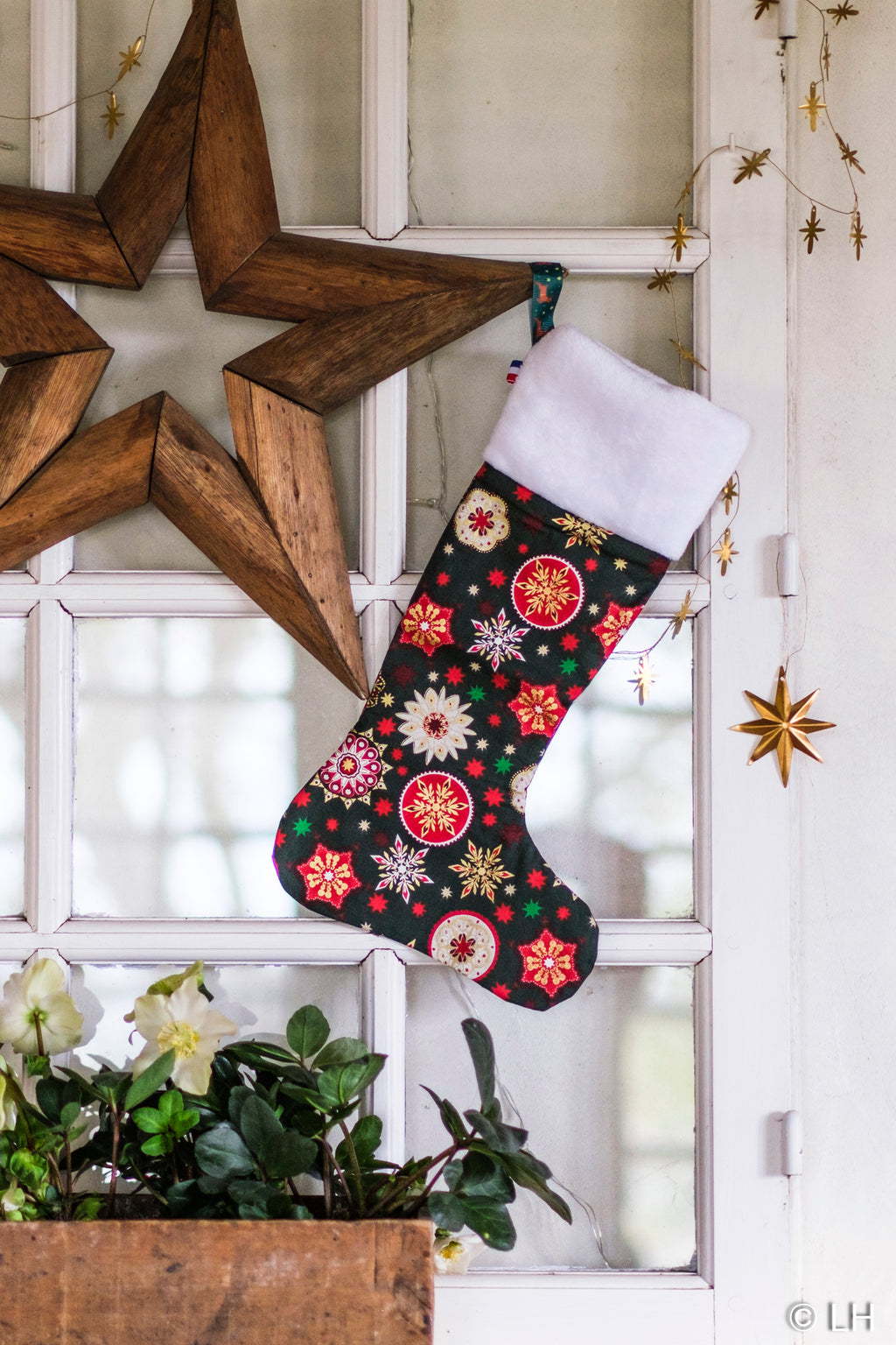 Botte de Noël vert foncé aux motifs étoiles de Noël