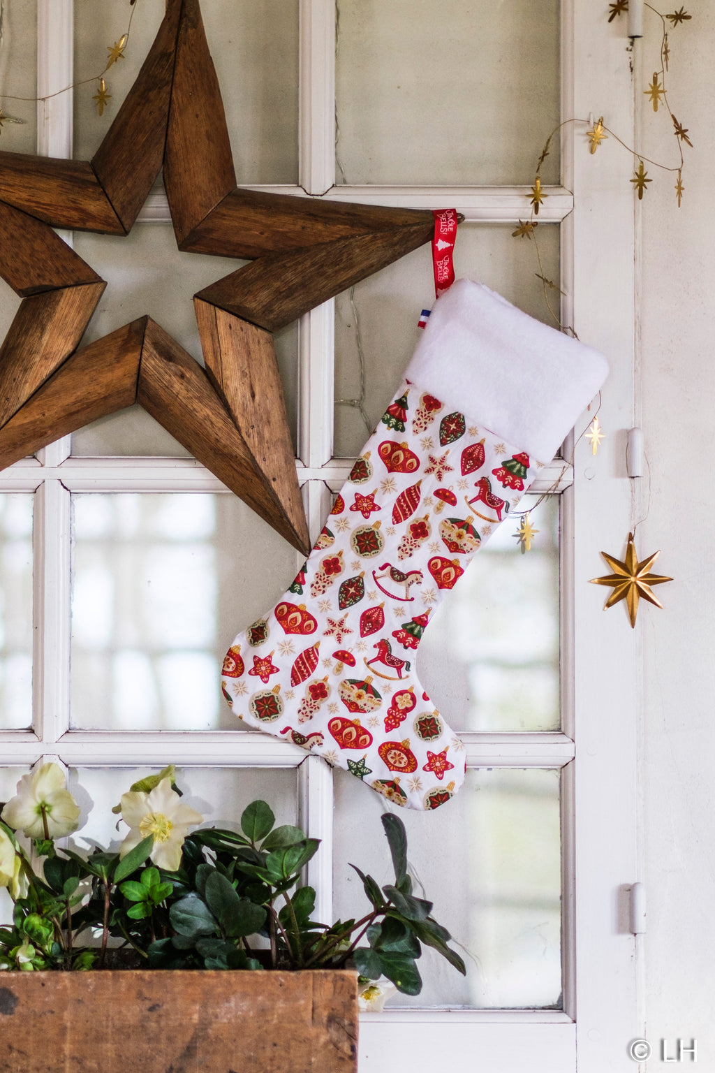 Botte de Noël blanche aux motifs décorations de Noël