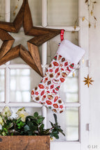 Botte de Noël blanche aux motifs décorations de Noël