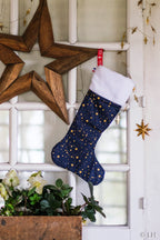 Botte de Noël bleu profond aux motifs étoiles dorées