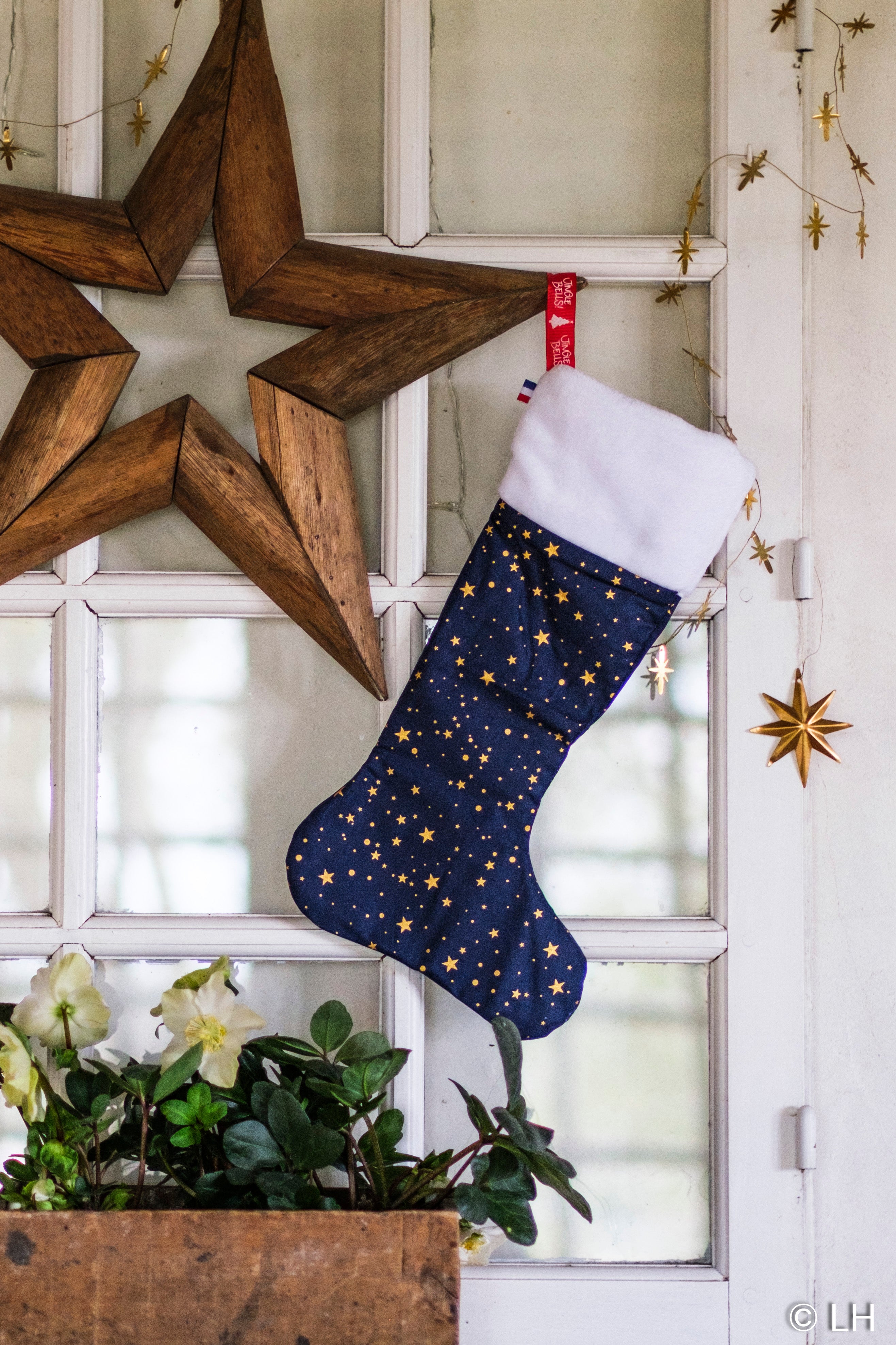 Botte de Noël bleu profond aux motifs étoiles dorées