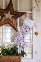 Botte de Noël blanche aux motifs flocons de neige colorés