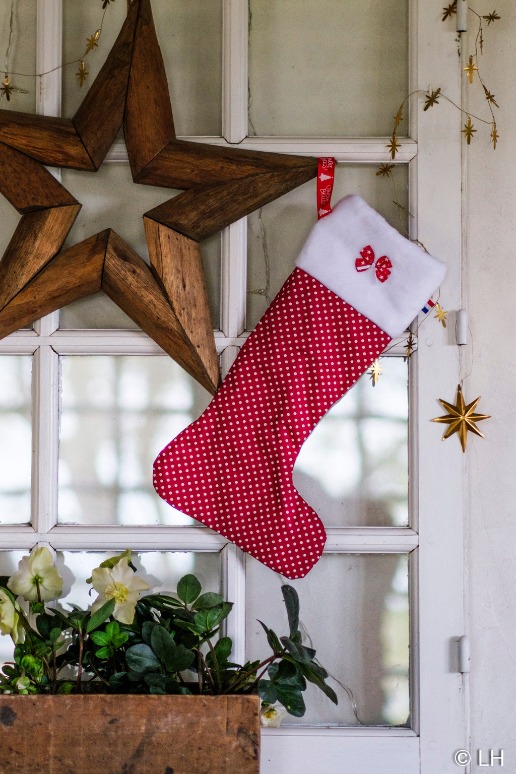 Botte de Noël rouge à pois blancs et son petit nœud