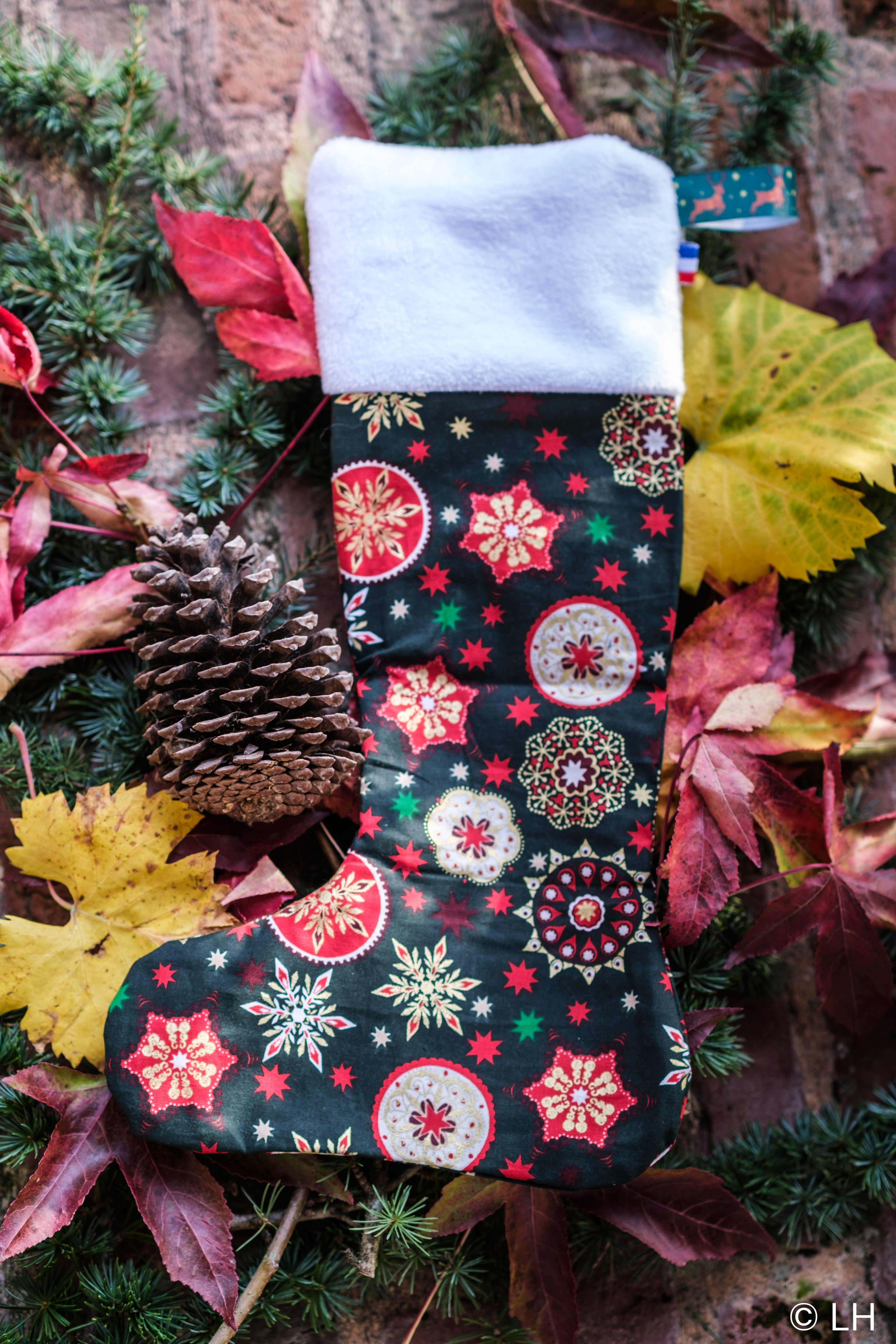 Botte de Noël vert foncé aux motifs étoiles de Noël