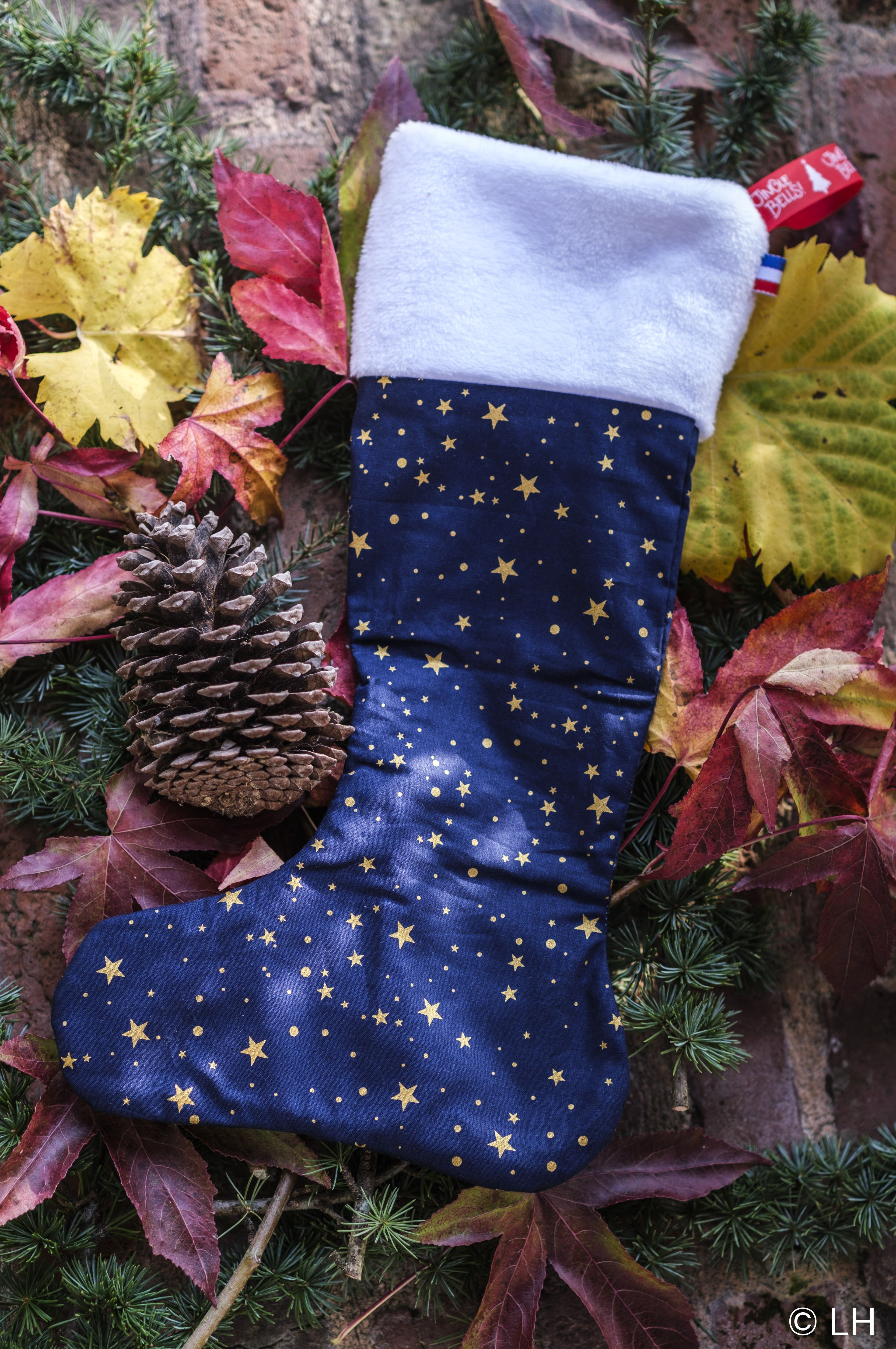 Botte de Noël bleu profond aux motifs étoiles dorées